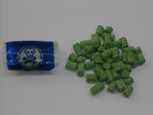 Decal bait bag, which is dark blue with a skull icon, and Decal pellets loose, which are green and cylinder shaped