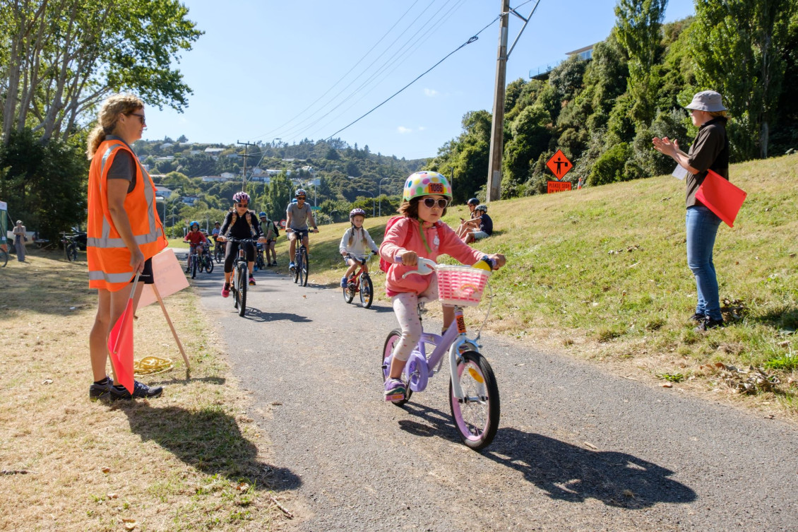 A child cycling along the trail